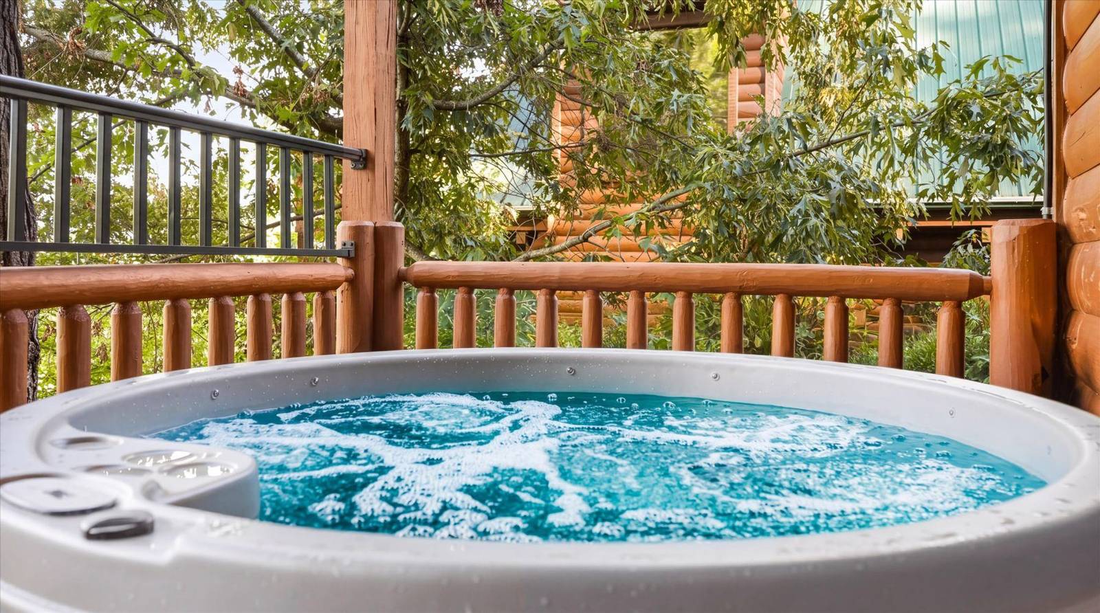 Hot tub with bubbling water on a wooden deck surrounded by trees